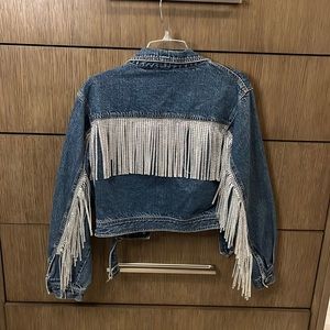 Cute crop Jean/denim jacket with bling fringe. Size medium.